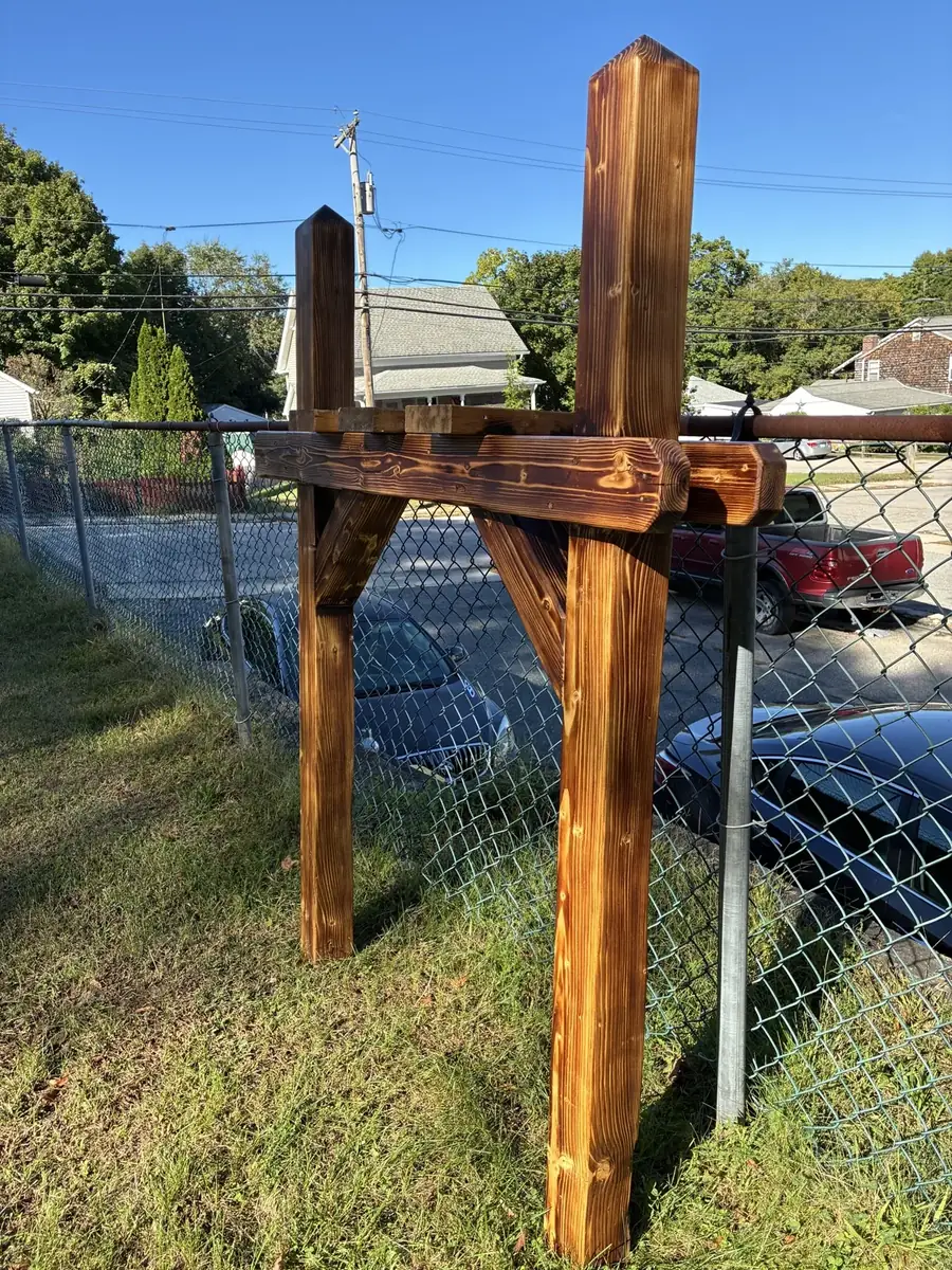 Charred-finish post standing in the sunlight
